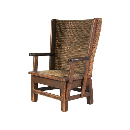 670 - A child's pine Orkney chair. Early 20th century, with straw back and drop-in rush seat, height 55cm,... 