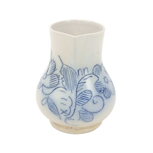 673 - A good scratch blue decorated English salt-glazed baluster cream jug. Circa 1760, with a sparrow bea... 