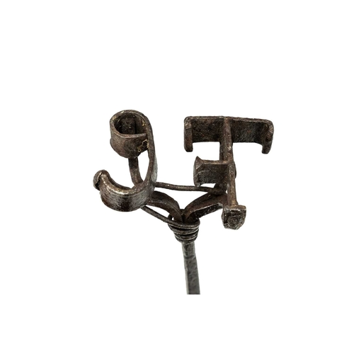 677 - A rustic wrought branding iron. 18th/early 19th century, with the initials TC, turned wood shaft, le... 