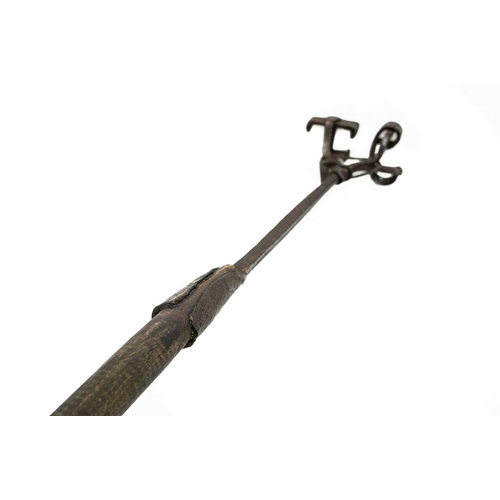 677 - A rustic wrought branding iron. 18th/early 19th century, with the initials TC, turned wood shaft, le... 
