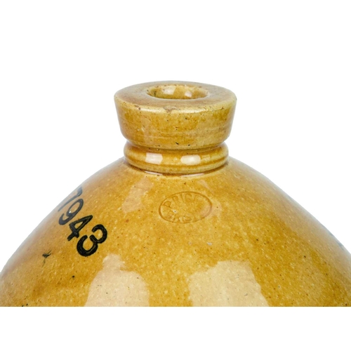 681 - Three Redruth stoneware flagons. Two for Redruth Brewery Co Ltd, height 40cm and smaller, numbered 1... 