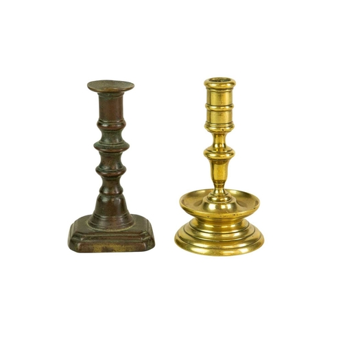 688 - A 17th century style Dutch brass taper stick. With a baluster stem, lower drip pan and bell shape ba... 