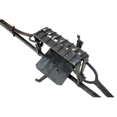 694 - A 19th century wrought iron man trap. With 26cm (10