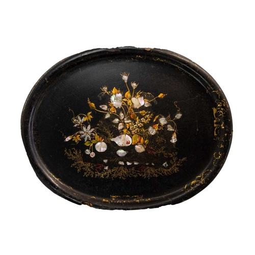 7 - An early Victorian black lacquered tea tray. The bracketed border painted with iron red, green and g... 