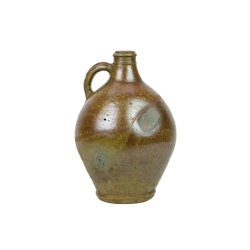712 - A 17th century German salt-glazed stoneware jug. With a simple loop handle, height 30cm.