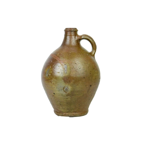 712 - A 17th century German salt-glazed stoneware jug. With a simple loop handle, height 30cm.
