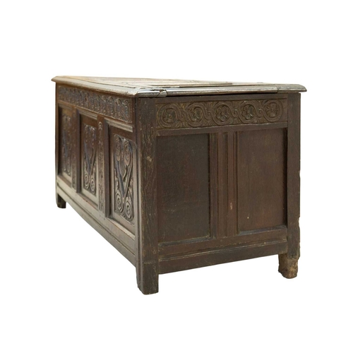 713 - An oak panel coffer. West Country, probably Somerset, 17th century, with a four panel lid above a gu... 
