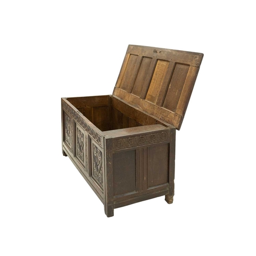 713 - An oak panel coffer. West Country, probably Somerset, 17th century, with a four panel lid above a gu... 