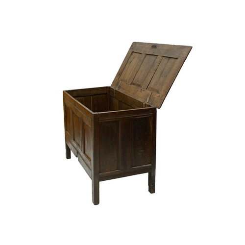 715 - An oak panel coffer. 18th century, height 75cm, width 111cm, depth 56cm.