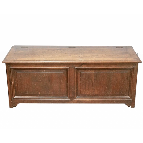716 - An oak panel coffer. 19th century, with a hinged lid and fielded panel front, height 55cm, width 139... 