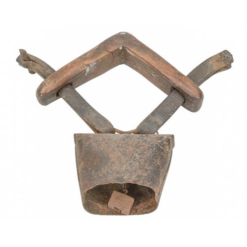 722 - A 19th century 'clucket' type sheep bell. The iron bell attached to a wooden yoke neck-piece with le... 