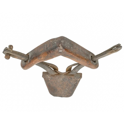 722 - A 19th century 'clucket' type sheep bell. The iron bell attached to a wooden yoke neck-piece with le... 