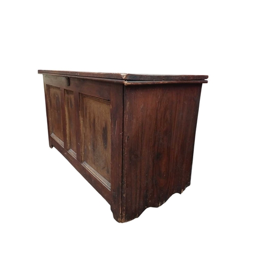 724 - A Victorian pine blanket chest. With a triple panel front, painted and stained finish, internally wi... 