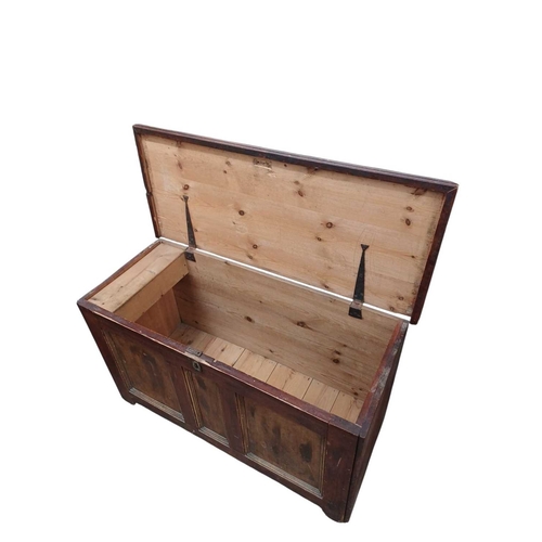 724 - A Victorian pine blanket chest. With a triple panel front, painted and stained finish, internally wi... 