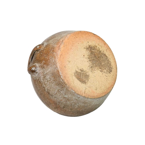 725 - A large pottery storage jug. 18th century, with a broad, rounded body and unglazed exterior, with a ... 