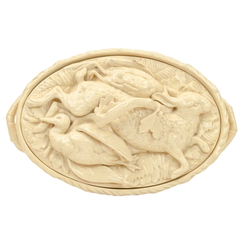 726 - A Mintons game pie dish and cover. Circa 1885, with a cream coloured glaze, the base moulded in the ... 