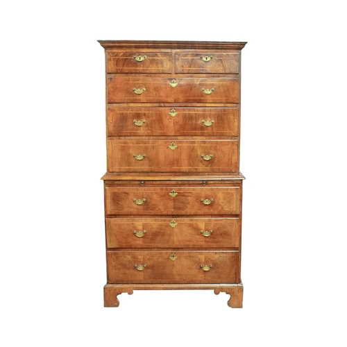 730 - An 18th century walnut chest on chest. The upper part with a moulded cornice above two short and thr... 