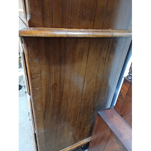 730 - An 18th century walnut chest on chest. The upper part with a moulded cornice above two short and thr... 