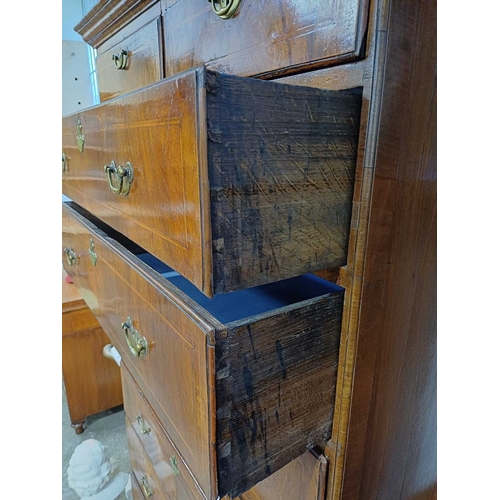 730 - An 18th century walnut chest on chest. The upper part with a moulded cornice above two short and thr... 