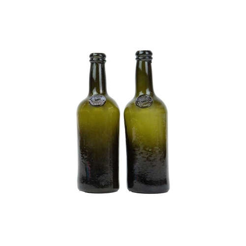 738 - Two sealed green glass half wine bottles. Circa 1820, each with Middle Temple seals with a lamb and ... 