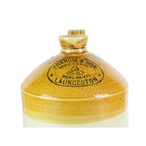 748 - Local interest. Three Launceston stoneware flagons. A 'Francis & Son Wine & Spirit Merchants' flagon... 