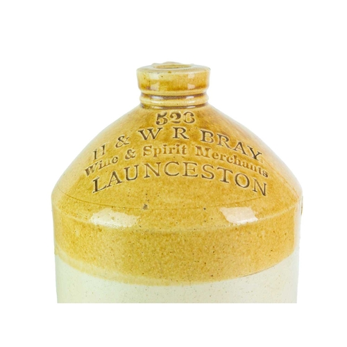 748 - Local interest. Three Launceston stoneware flagons. A 'Francis & Son Wine & Spirit Merchants' flagon... 