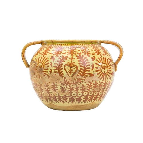 751 - A Continental faience twin handled jar. Possible French or Spanish, 18th/19th century, the ochre gro... 