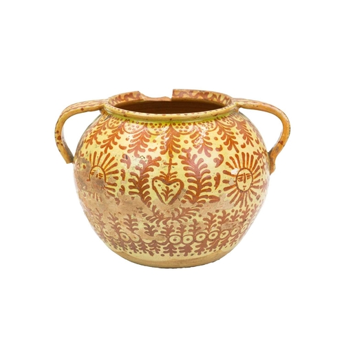 751 - A Continental faience twin handled jar. Possible French or Spanish, 18th/19th century, the ochre gro... 