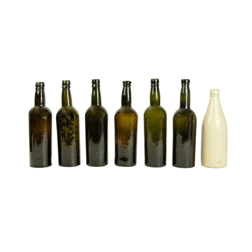 755 - Six 19th century glass wine bottles of dark olive green tint. Various bases. All approximately 30cm ... 