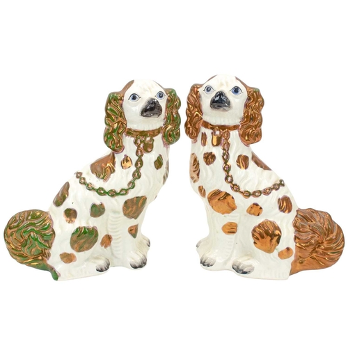 759 - A pair of large Victorian Staffordshire lustre spaniels. With copper, pink and green markings, heigh... 