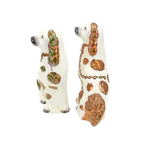 759 - A pair of large Victorian Staffordshire lustre spaniels. With copper, pink and green markings, heigh... 