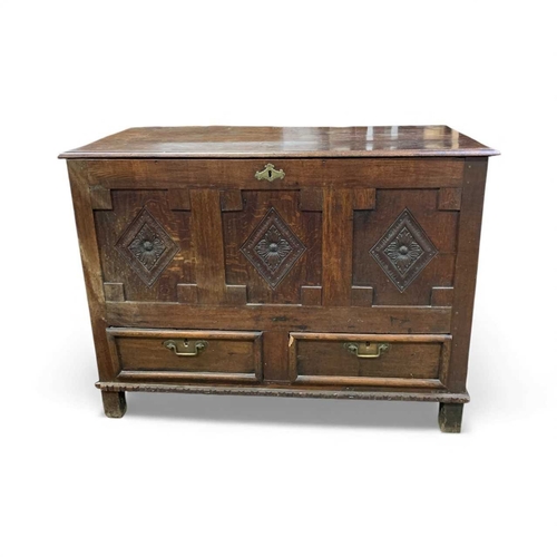 761 - An 18th century oak mule chest. With three lozenge carved panels above two drawers. Height 96cm, wid... 