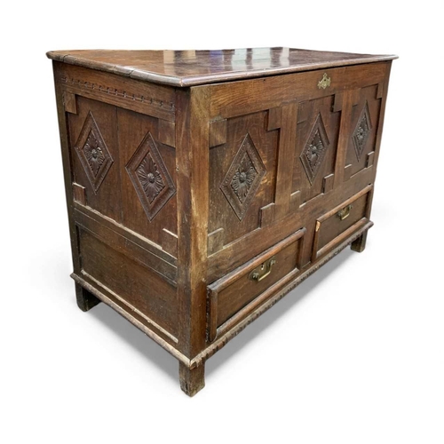 761 - An 18th century oak mule chest. With three lozenge carved panels above two drawers. Height 96cm, wid... 