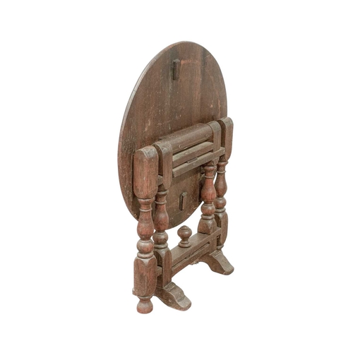 765 - A circular joined oak drop top occasional table. Circa 1900, in the 17th century style, with a twist... 