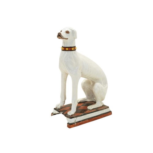 780 - A remarkable life size Italian faience model of a seated greyhound. 19th century, sporting a painted... 