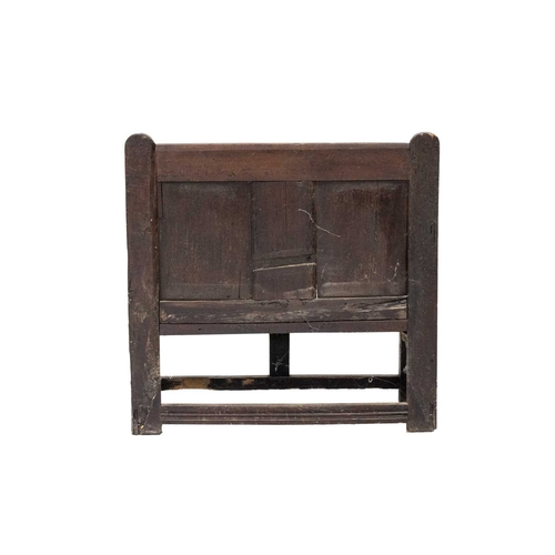 800 - A joined oak hall bench. Partially 17th century, the back with a central panel initialled T R I and ... 