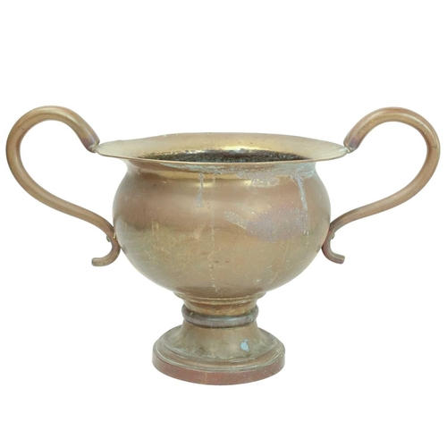 802 - An oversized brass two handled urn or vase. 19th century, possibly a shop advertising promotion piec... 