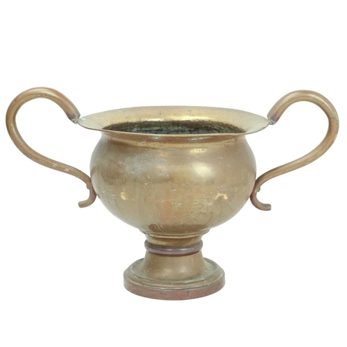 802 - An oversized brass two handled urn or vase. 19th century, possibly a shop advertising promotion piec... 