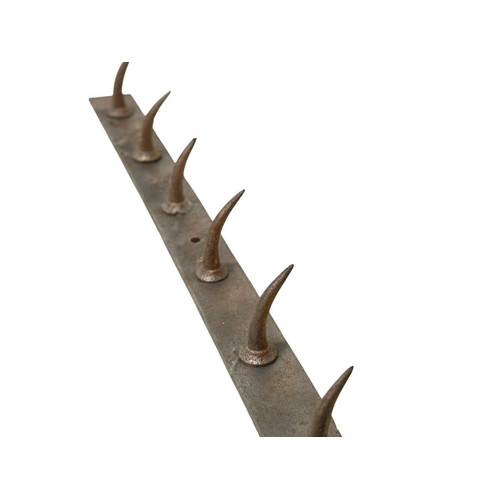 81 - A late 19th/early 20th century French butcher's hook rack. Height 5cm, width 152cm, depth 1cm. Prove... 