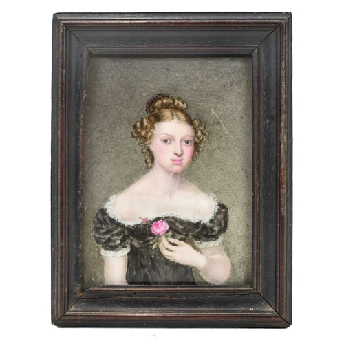 819 - A portrait miniature on porcelain of a young woman. Mid 19th century, wearing a lace trimmed black d... 