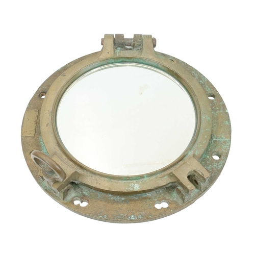 839 - A ship's brass porthole. Of typical, heavy cast construction, now fitted a mirror, overall diameter ... 