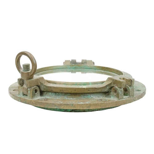 839 - A ship's brass porthole. Of typical, heavy cast construction, now fitted a mirror, overall diameter ... 