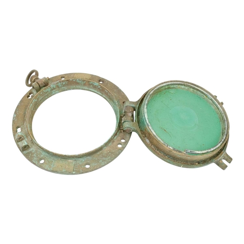 839 - A ship's brass porthole. Of typical, heavy cast construction, now fitted a mirror, overall diameter ... 