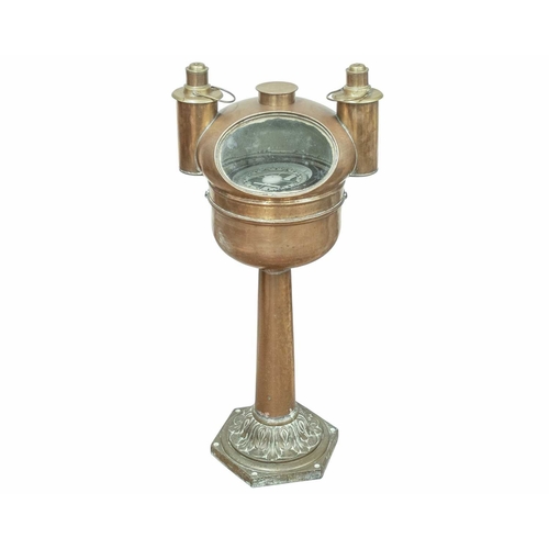 859 - A ship's brass pedestal binnacle compass. Circa 1900, the domed cover with twin side lamps, the comp... 
