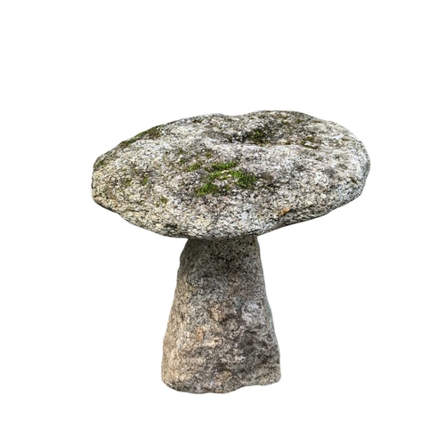 863 - A granite staddle stone 'mushroom'. Height 54cm, diameter 45cm.