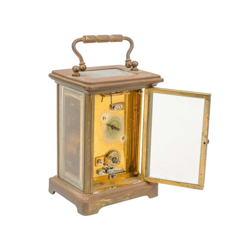 885 - A French brass carriage timepiece. Height 11.5cm, with travel case.