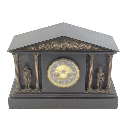 887 - A Victorian black slate mantel clock. The case of architectural form, with a bronzed pediment and fi... 