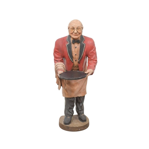 89 - A novelty dumbwaiter. Modelled as an elderly gentleman wearing glasses, red jacket and bow tie, etc.... 