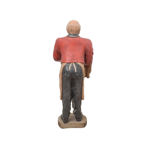 89 - A novelty dumbwaiter. Modelled as an elderly gentleman wearing glasses, red jacket and bow tie, etc.... 