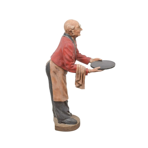 89 - A novelty dumbwaiter. Modelled as an elderly gentleman wearing glasses, red jacket and bow tie, etc.... 